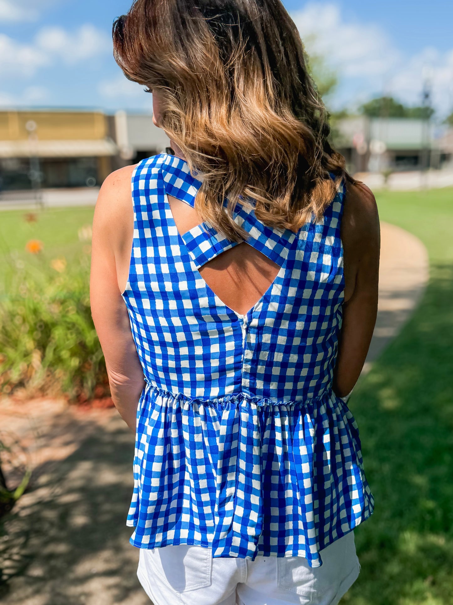 Sleeveless Gingham Cross Back Peplum V Neck Top